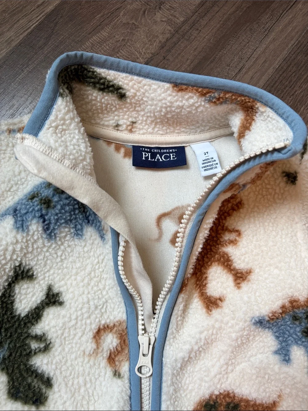 The Children's Place Cream Sherpa Zip Jacket with Blue, Brown & Green Dinosaurs